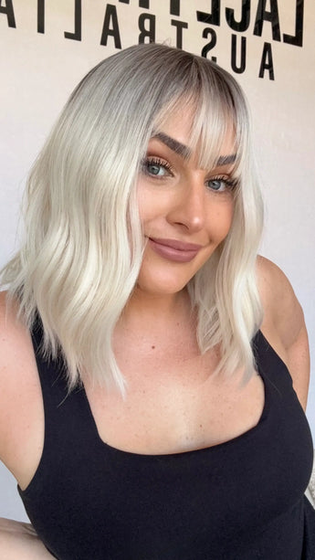 fringe synthetic heat safe, platinum blonde hair with dark root, middle part, glueless wig australia.
