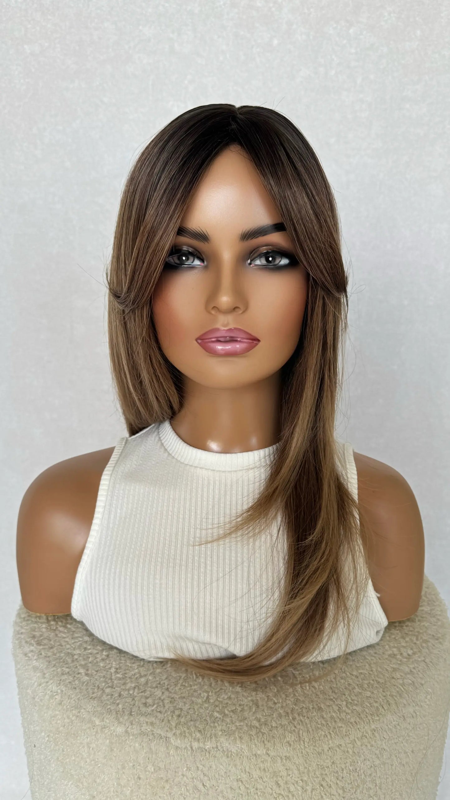 front view layered synthetic wig, middle part with curtain bangs and layers throughout