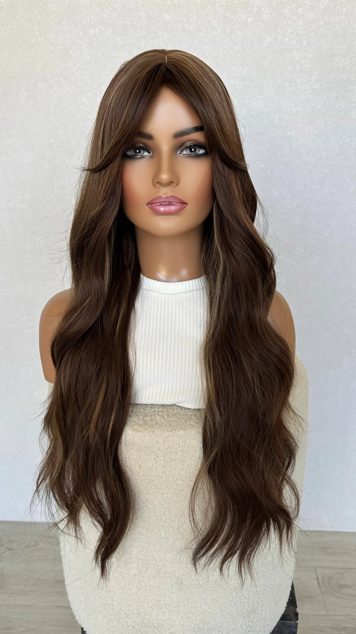 long fringe wig synthetic, middle part with long fringe parted to the side.