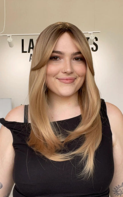 realistic layered blonde synthetic wig with curtain bangs and heat safe hair