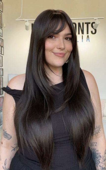 dark brown layrered hair wig, middle part with layers and a long fringe. 