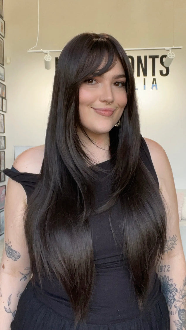 dark brown layrered hair wig, middle part with layers and a long fringe. 