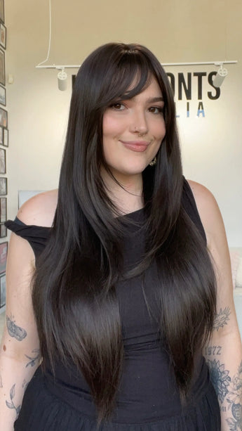 dark brown layrered hair wig, middle part with layers and a long fringe. 