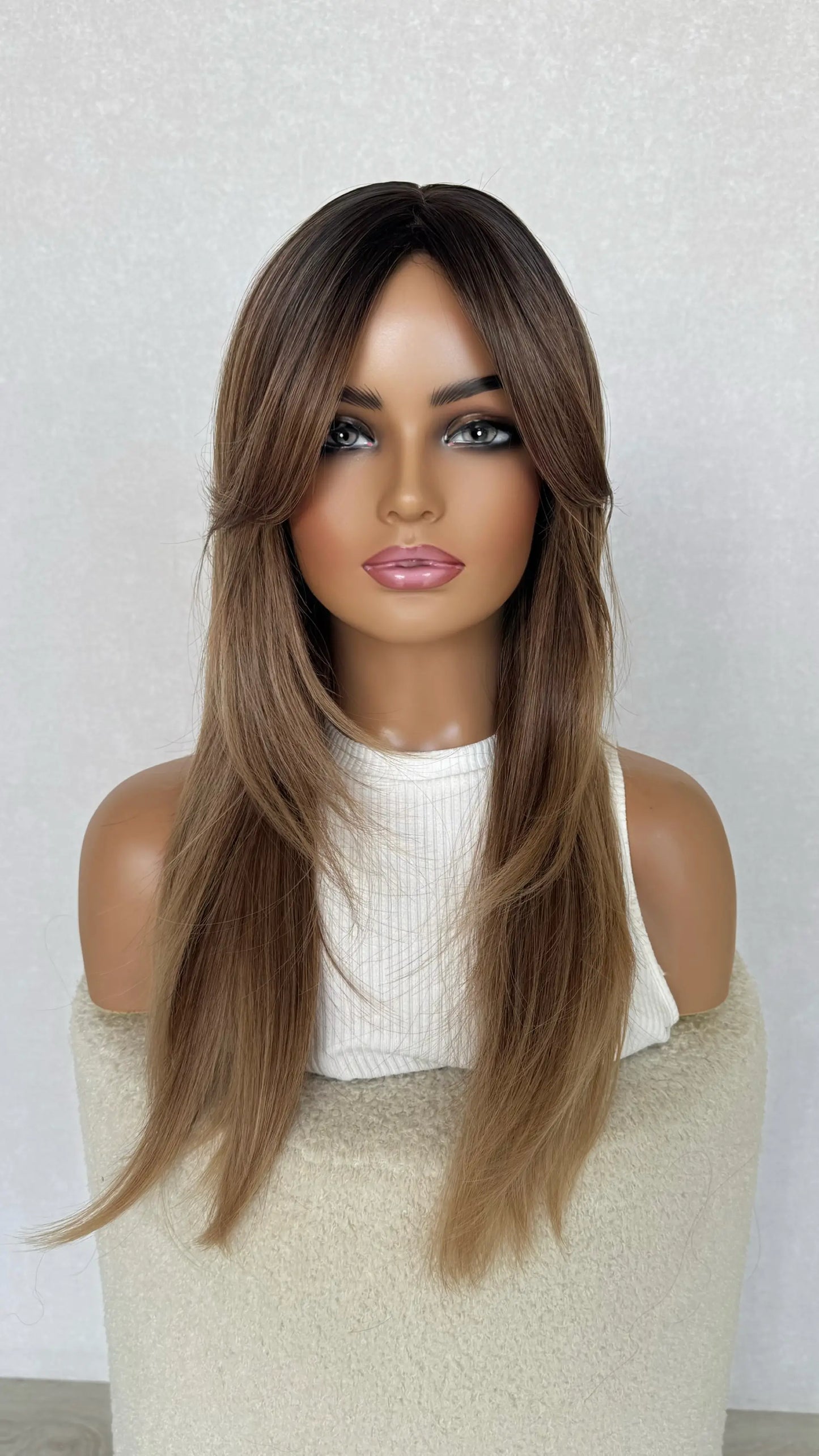 curtain bang synthetic, heat safe and glueless wig.
