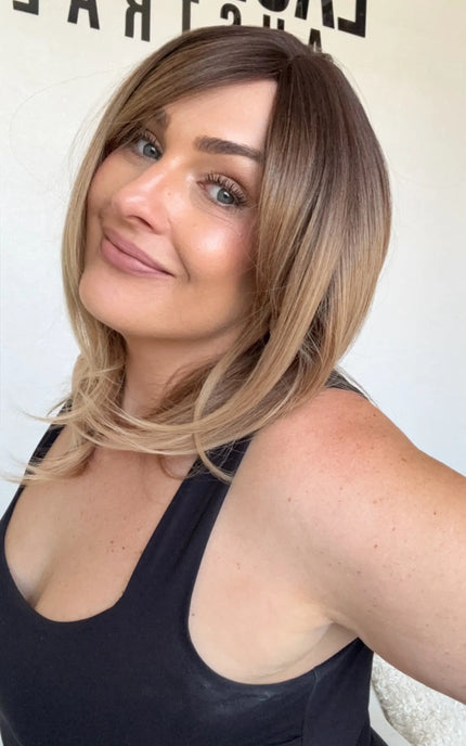 middle part, layered ombre hair, synthetic wig heat safe and glueless. curtain bangs.