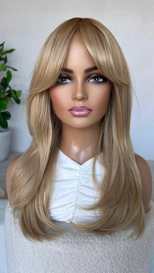 golden blonde middle part with layers