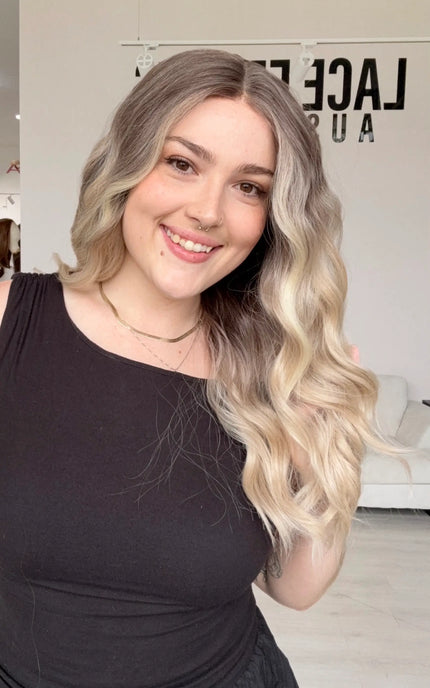 half hair to the side, a beachy wave styling lace front wig with a realistic hairline, middle part and heat safe hair for easy styling and customisation