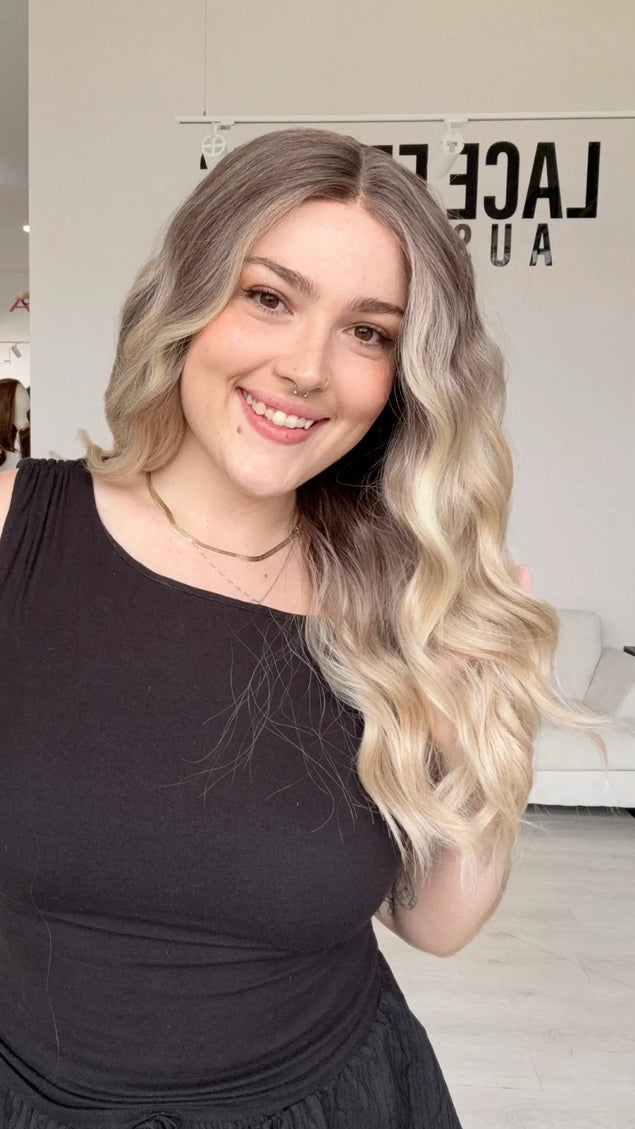 half hair to the side, a beachy wave styling lace front wig with a realistic hairline, middle part and heat safe hair for easy styling and customisation