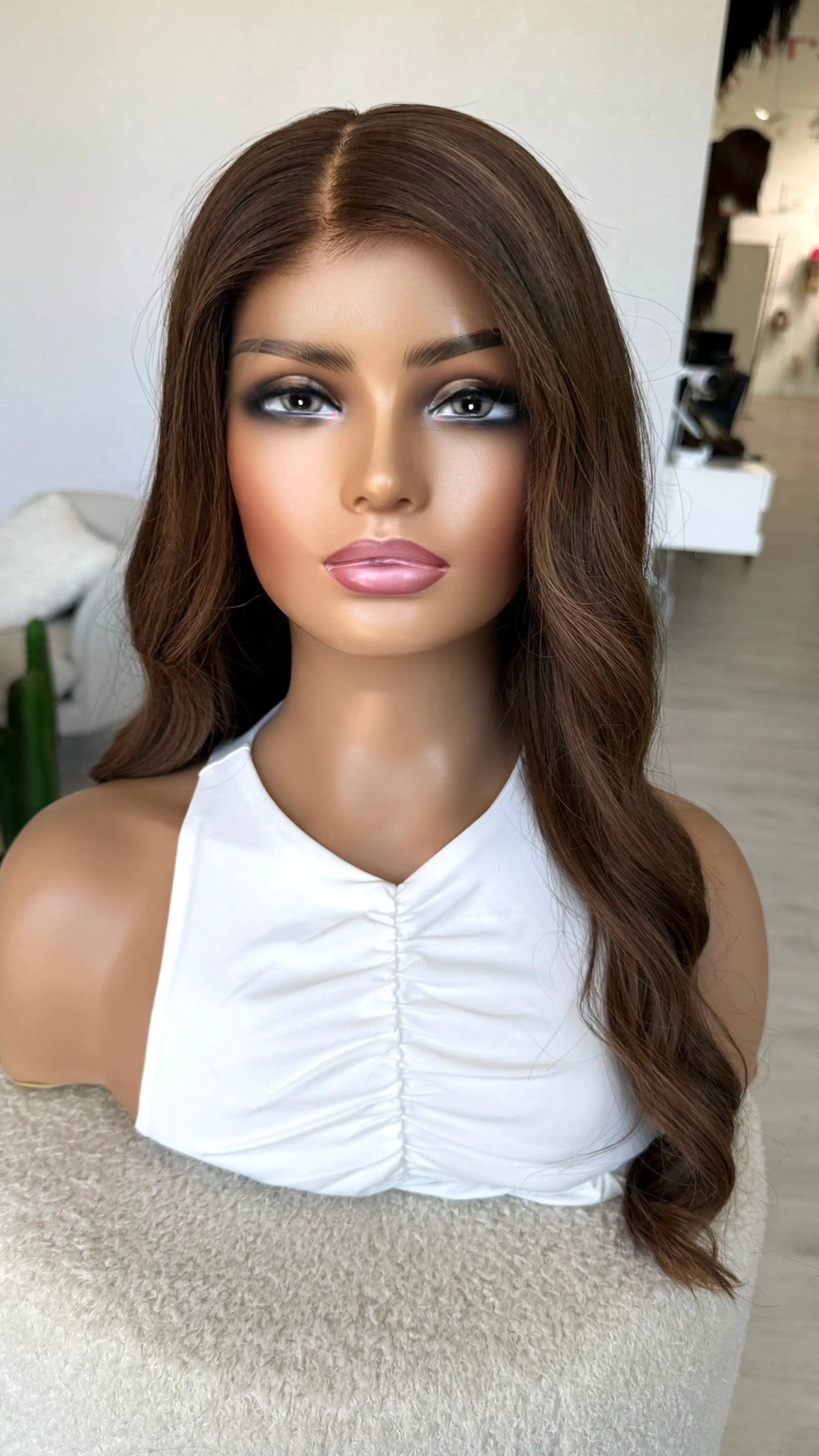 dark brunette warm toned, side view, half hair back half forward. medical lace front wig.