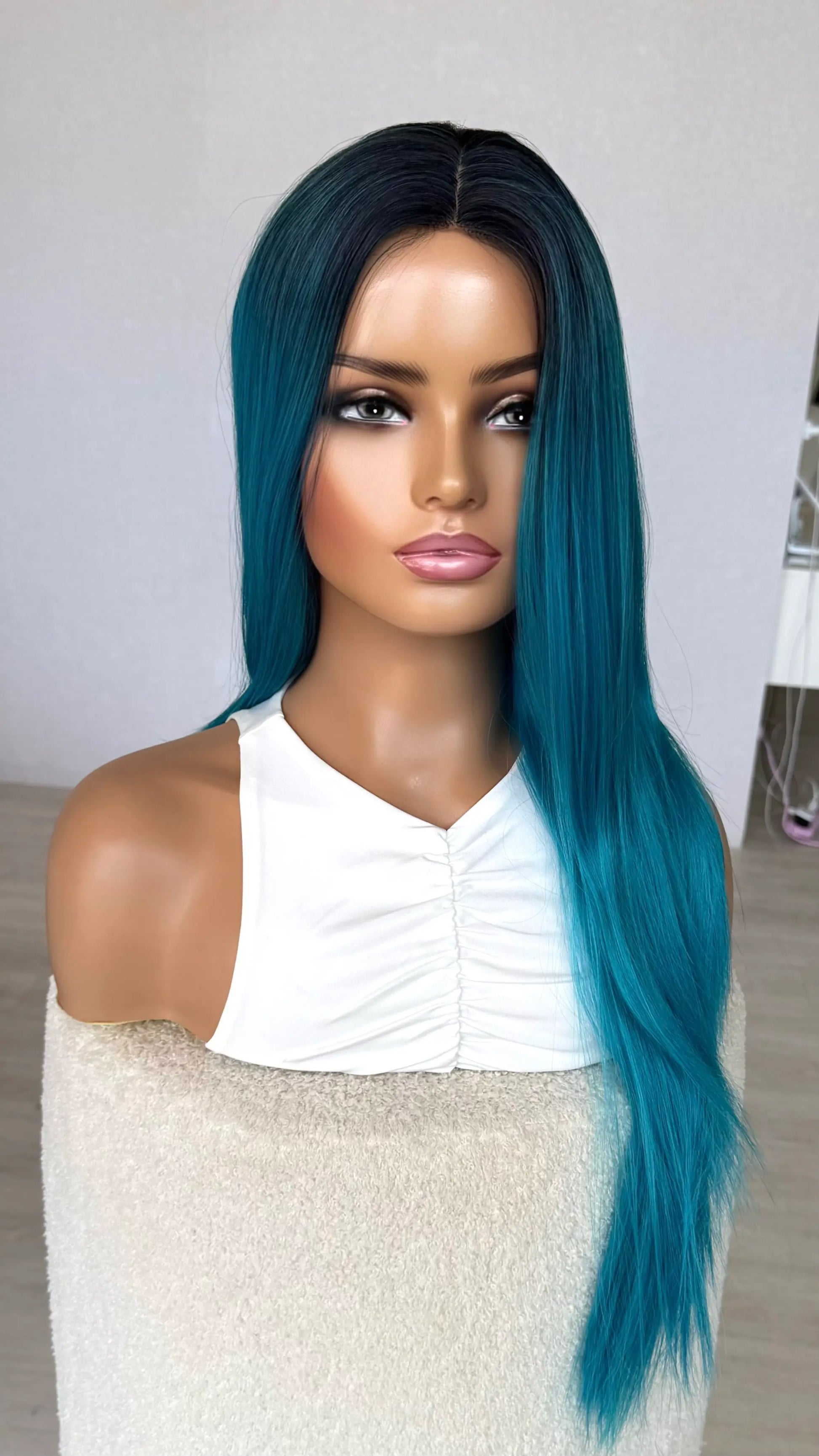 half hair back half forward, blue synthetic hair , dark root, straight hair.