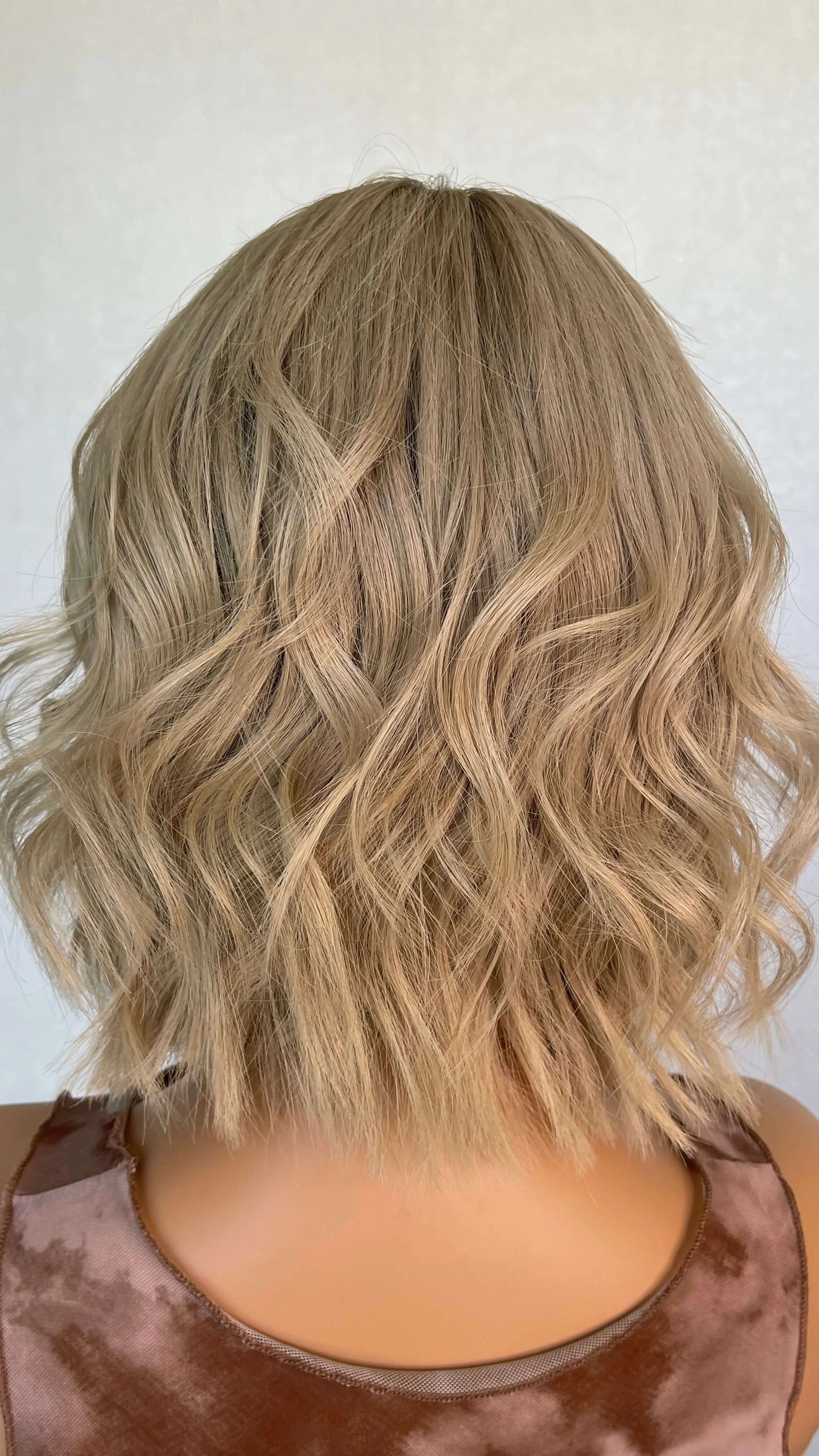 Lace front medical grade glueless wig with blonde wavy hair. 