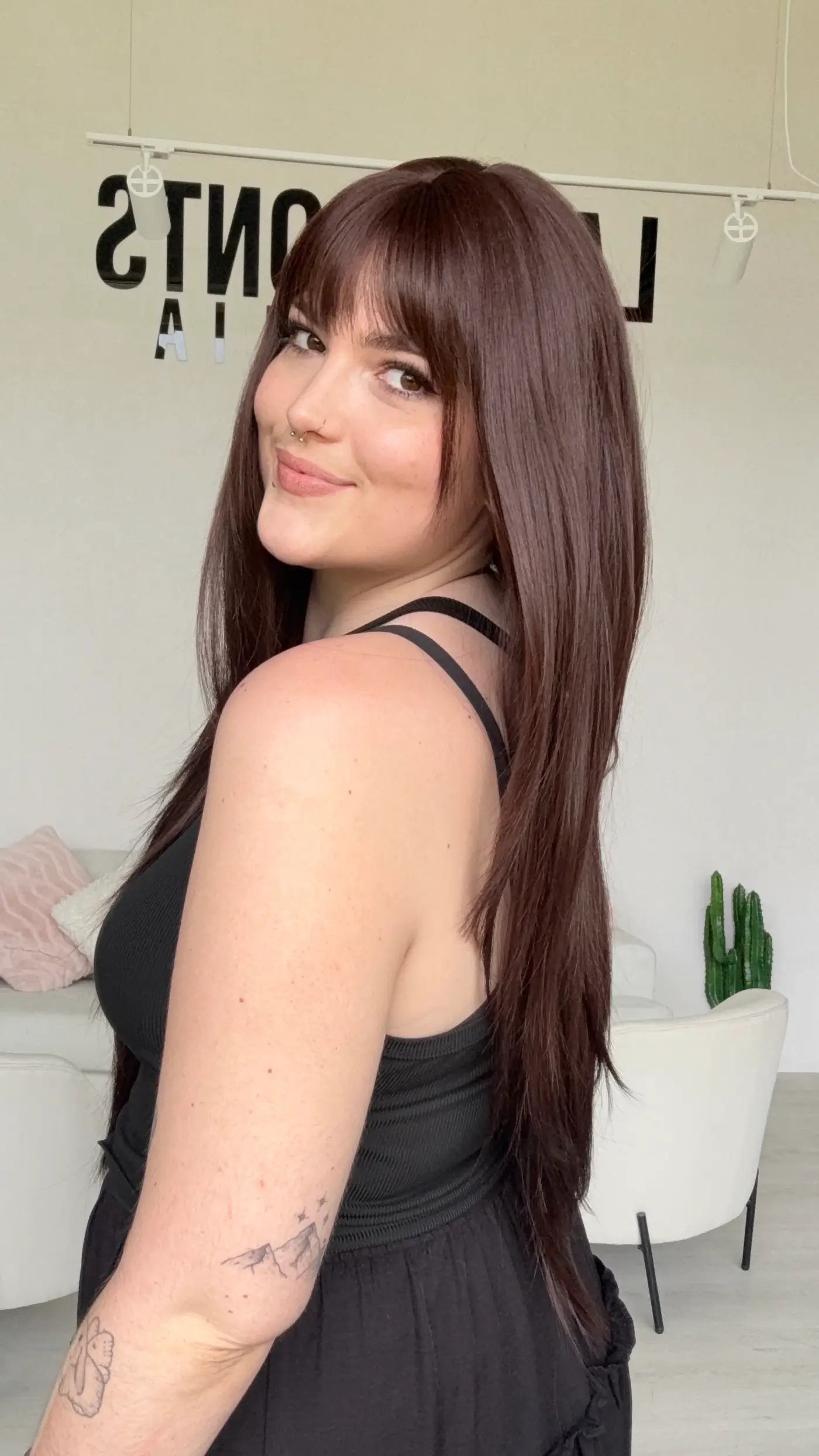 long layered burgundy synthetic wig with a glueless cap for easy everyday wear.