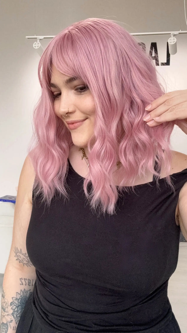 wavy pink hair synthetic, middle part with heat safe fibres, natrual pink synthetic wig australia, gold coast.