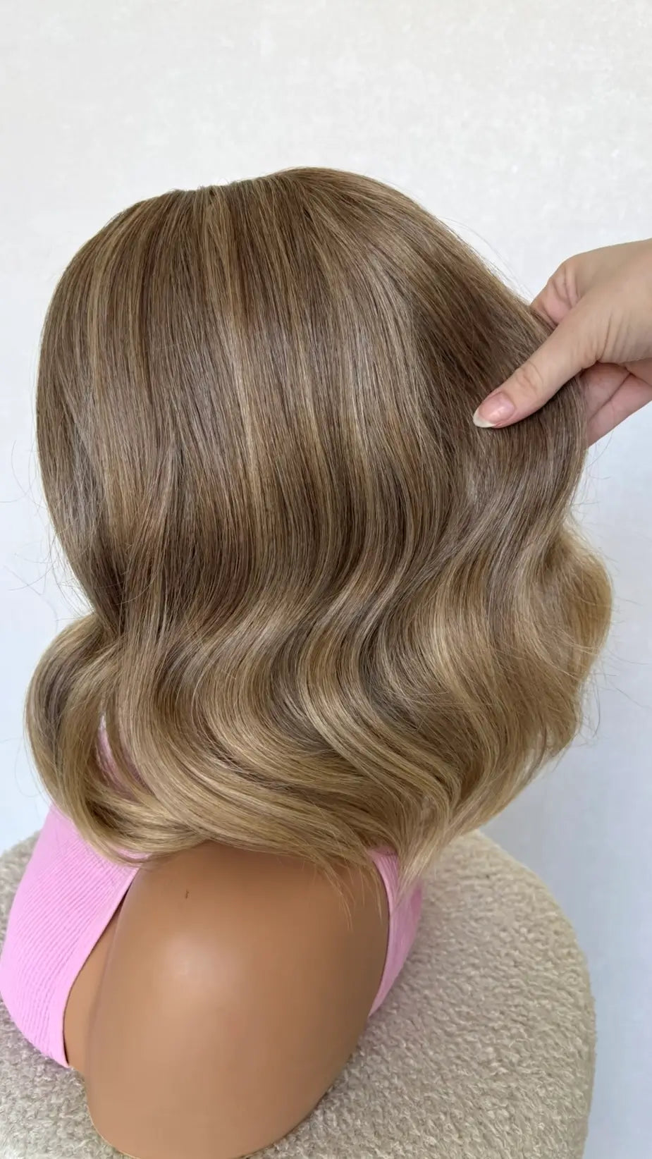 dune synthetic sandy blonde hair, lacefront wig holding the hair.