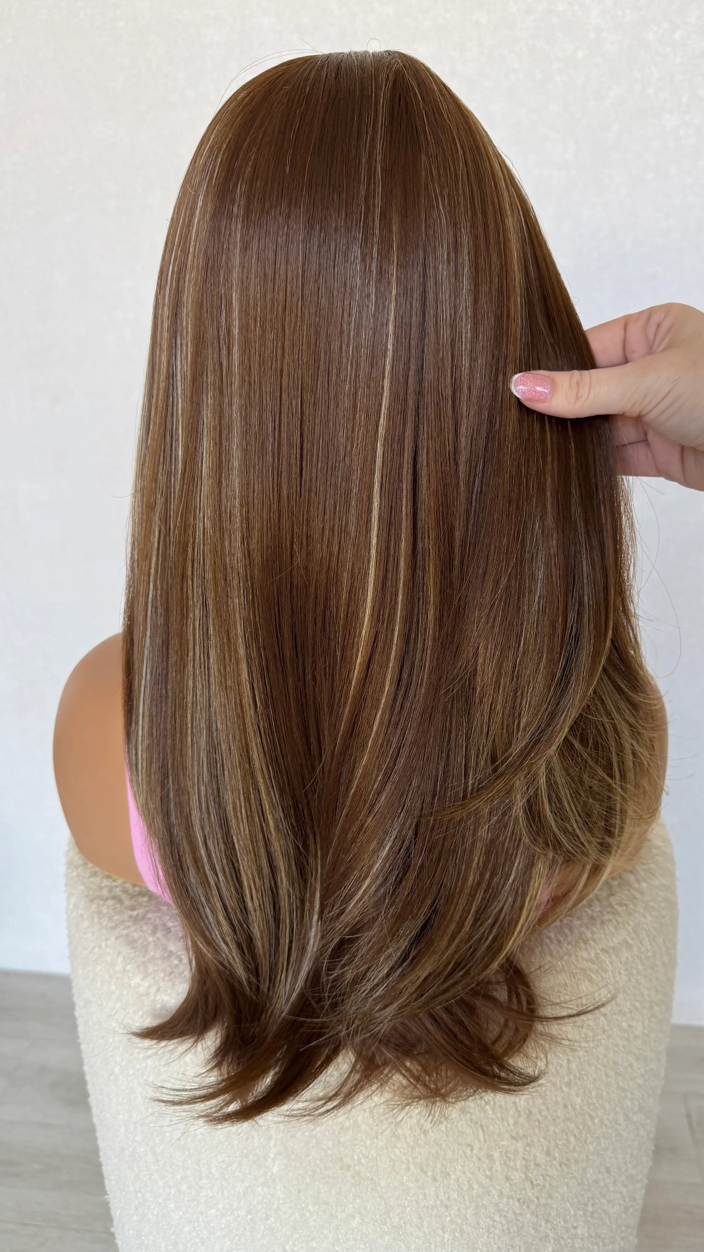 holding hair, all hair back, heat safe synthetic wig.