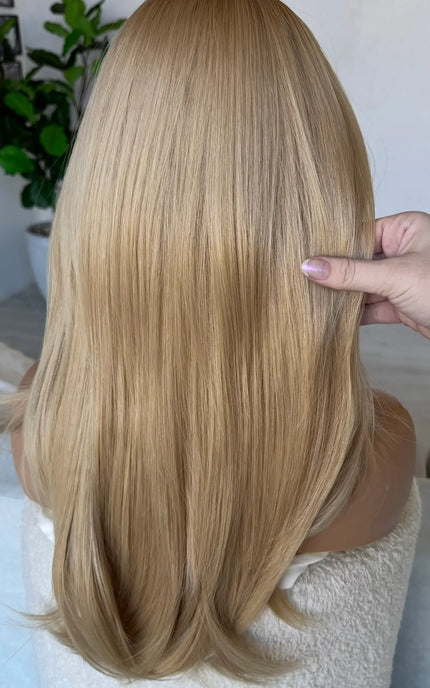 back view golden blonde hair straight.