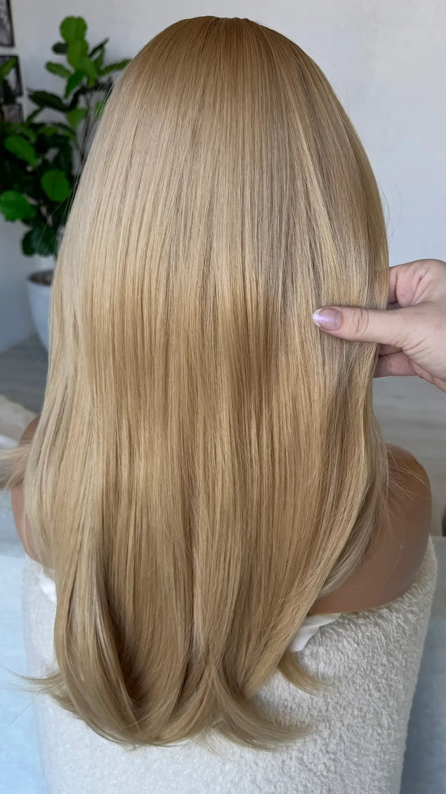 back view golden blonde hair straight.