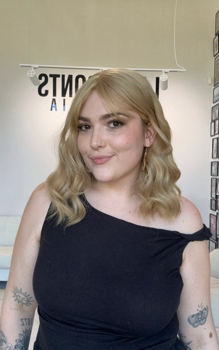 honey blonde wavy hair topper with fringe, middle parting.