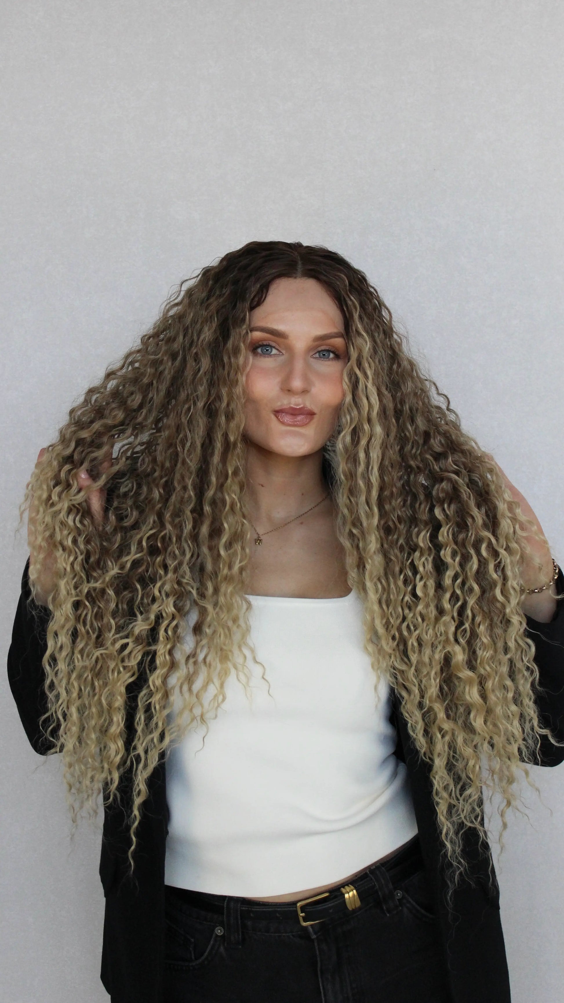 lacefront curly wig, synthetic hair, brown to ombre blonde, middle part.