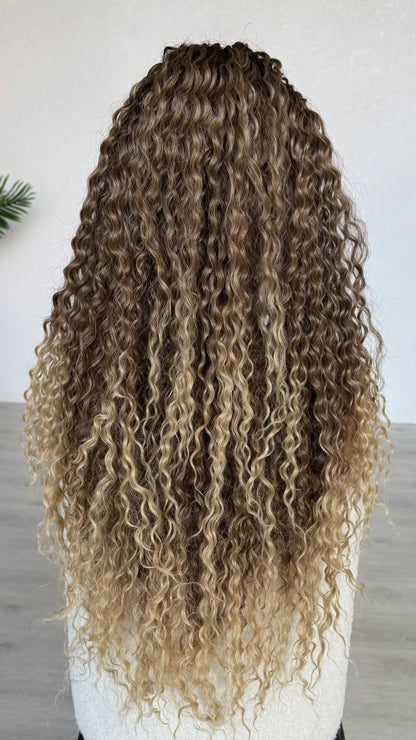 back view, long curly lacefront. t-part lace. light blonde ends. 