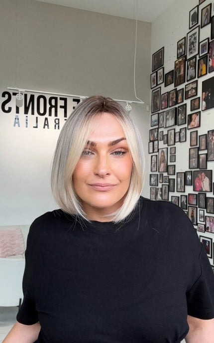natural looking icy blonde bob length synthetic wig with heat safe hair.