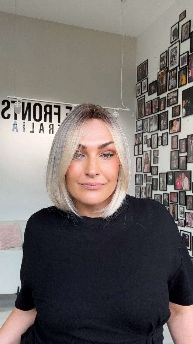 natural looking icy blonde bob length synthetic wig with heat safe hair.