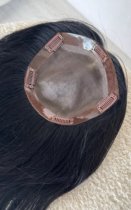human hair black topper, inside monofillament base. 20 inch hair length.