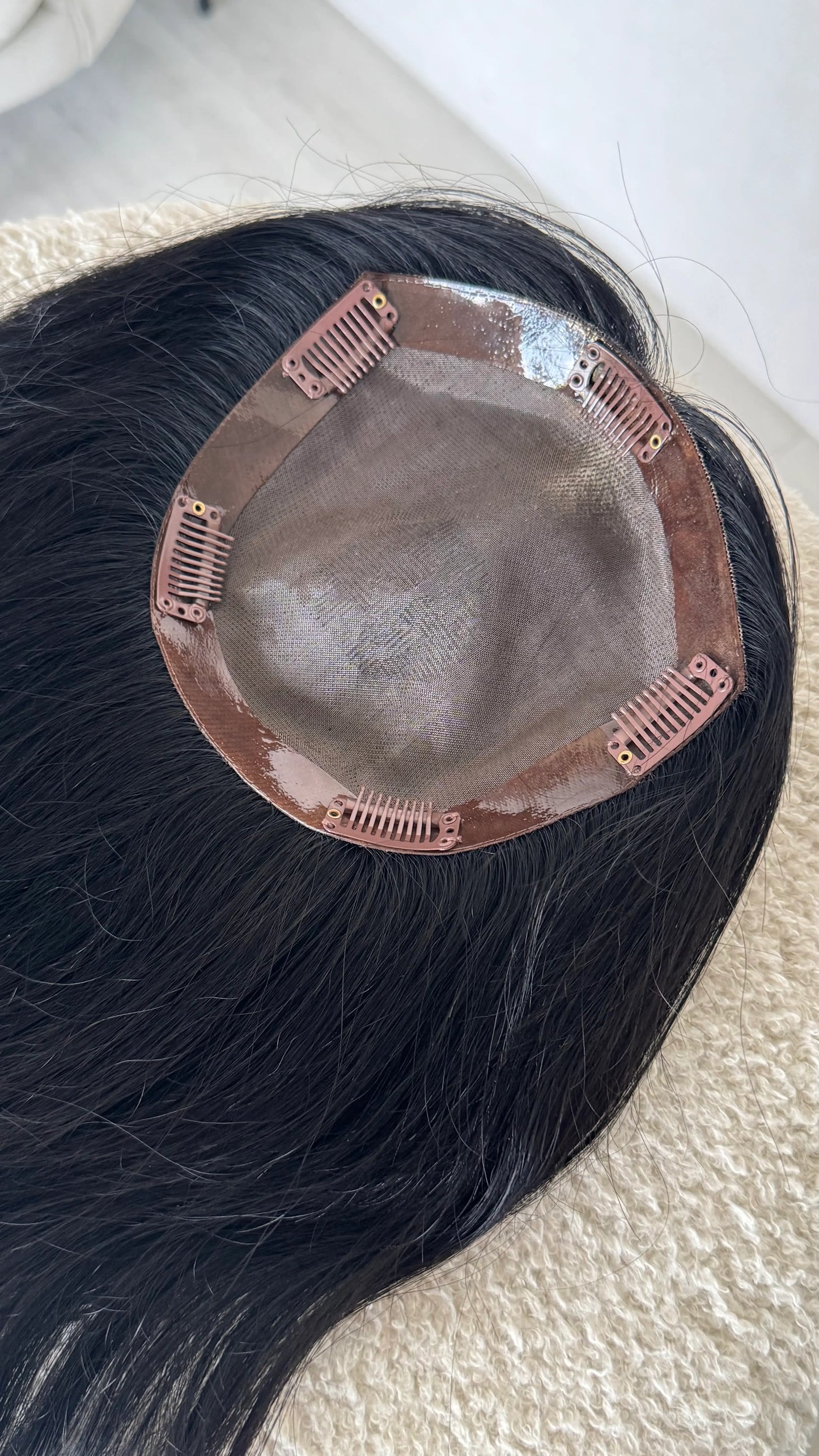 human hair black topper, inside monofillament base. 20 inch hair length.