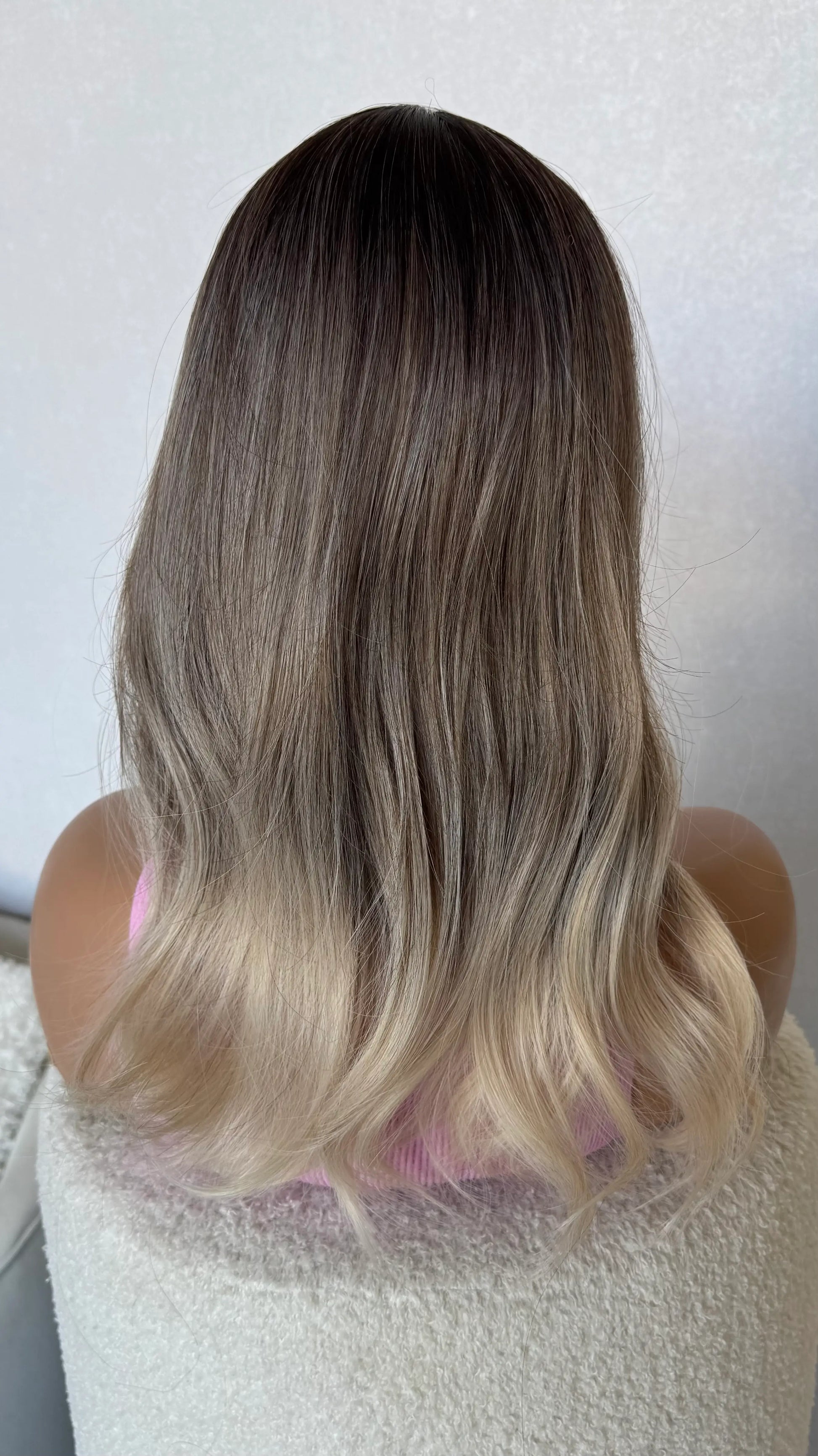 3 colour ombre dark root to platinum blonde.