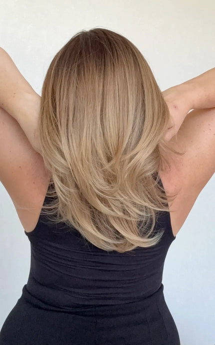 layered hair, middle part, ombre golden brunette to blonde.