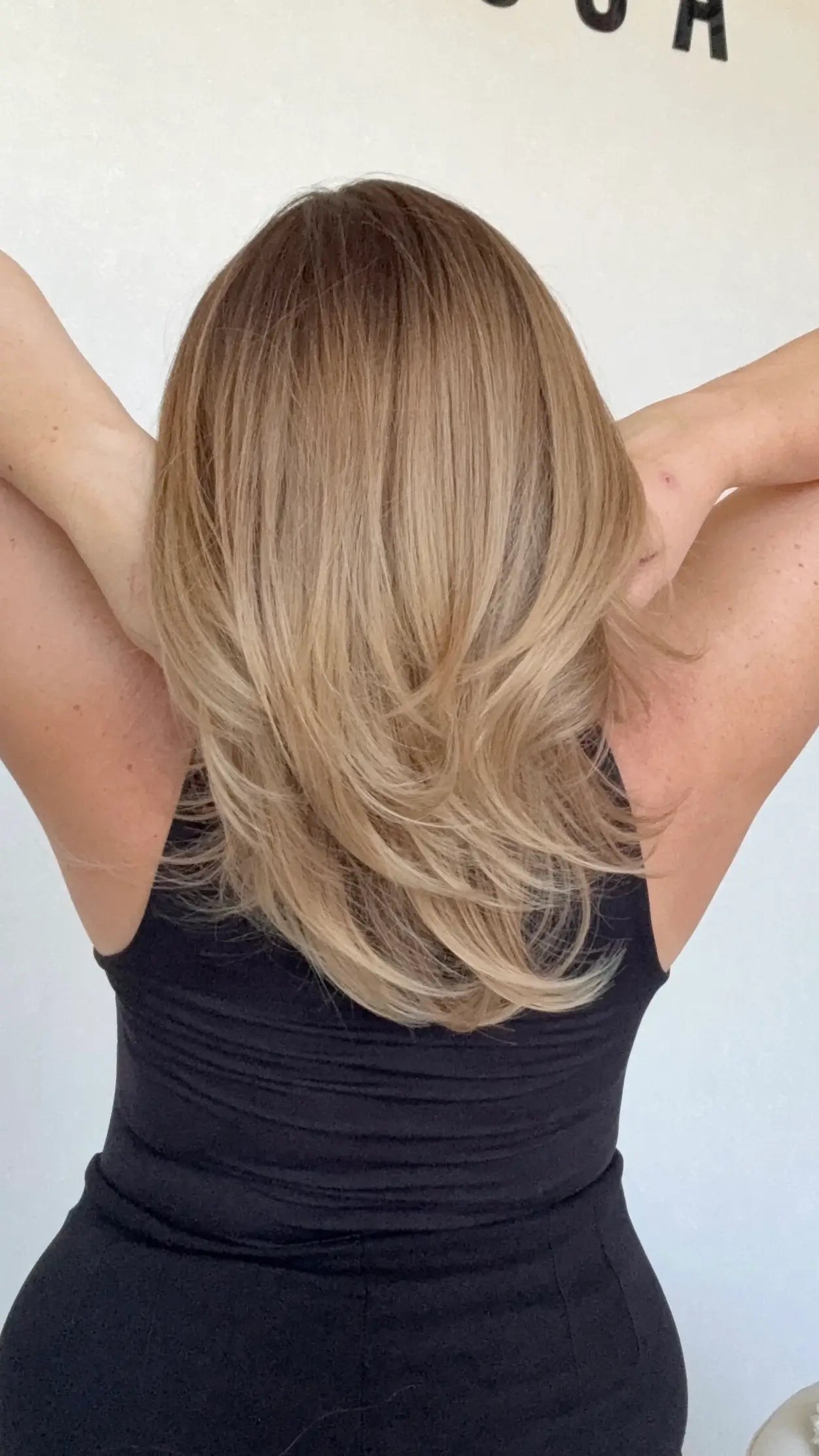 layered hair, middle part, ombre golden brunette to blonde.