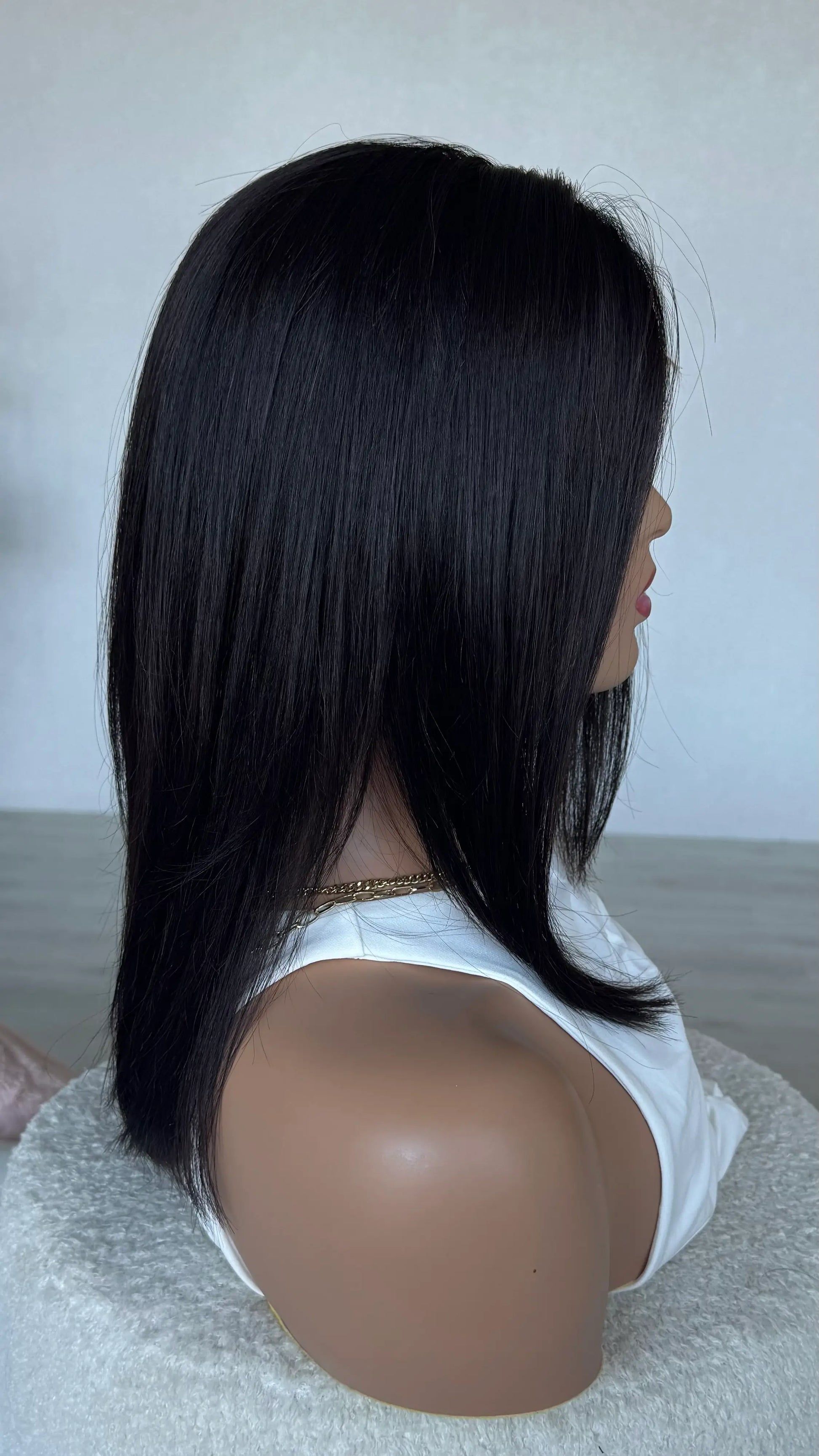 side view, jordyn colour dark brunette wig. one length.