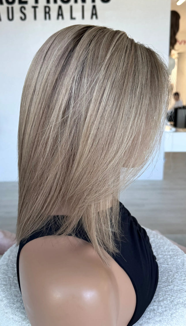 brazilian remy human hair wig, side on view. blonde wig 14 inches.