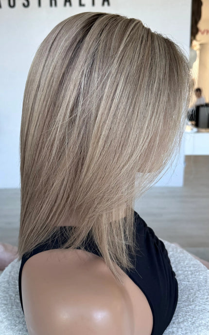 brazilian remy human hair wig, side on view. blonde wig 14 inches.