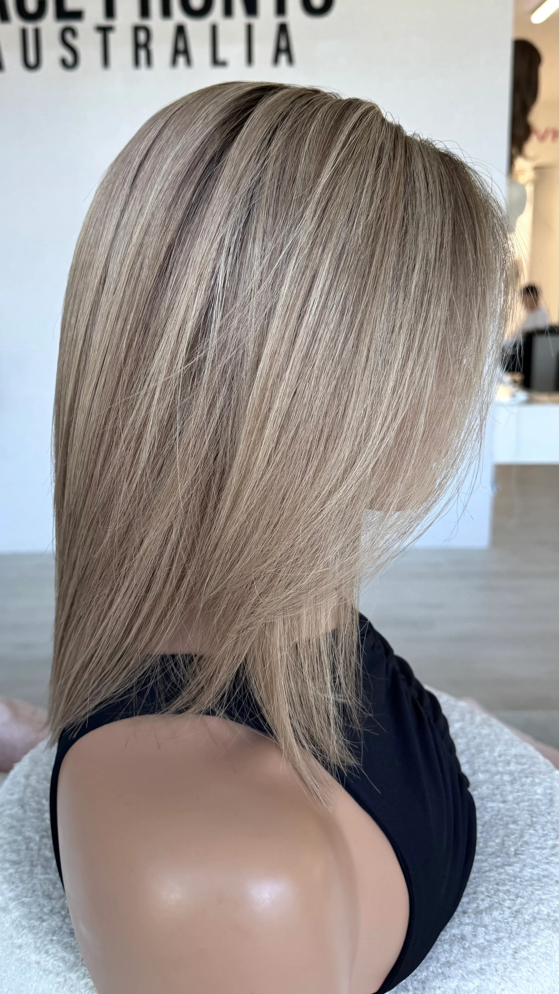 brazilian remy human hair wig, side on view. blonde wig 14 inches.