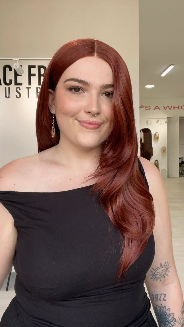 red hair lace front wig with a glueless cap and heat safe hair.