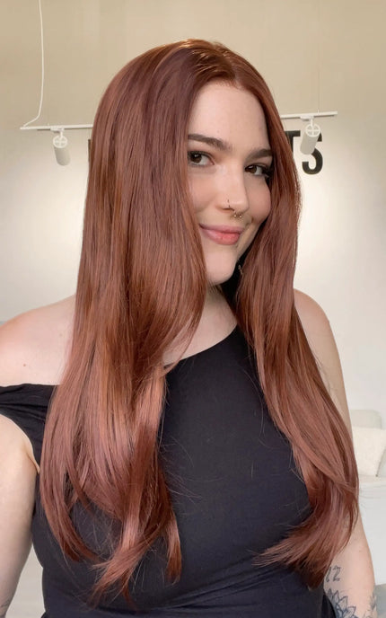 long natural looking red synthetic wig with a glueless, realistic hairline.