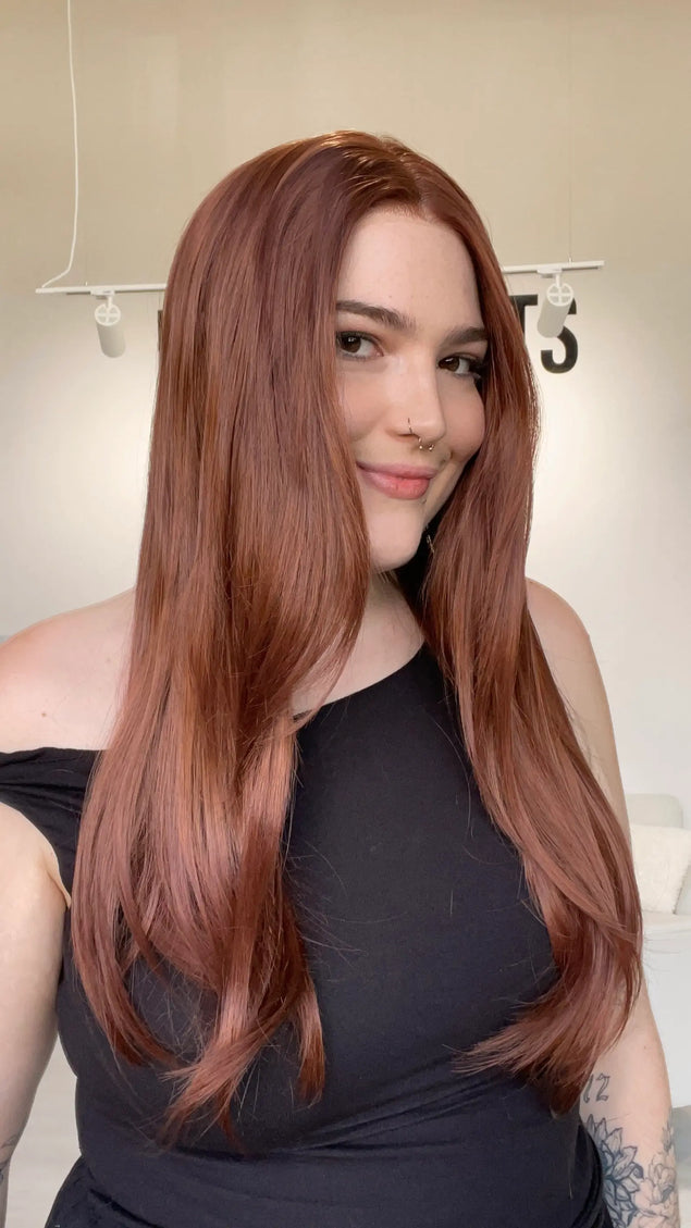 long natural looking red synthetic wig with a glueless, realistic hairline.