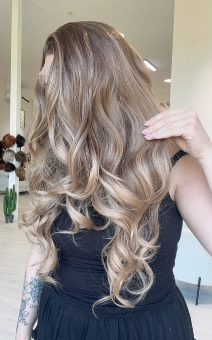 lace front glueless synthetic, darker root to soft light brown ends. heat safe wig, changeable parting.