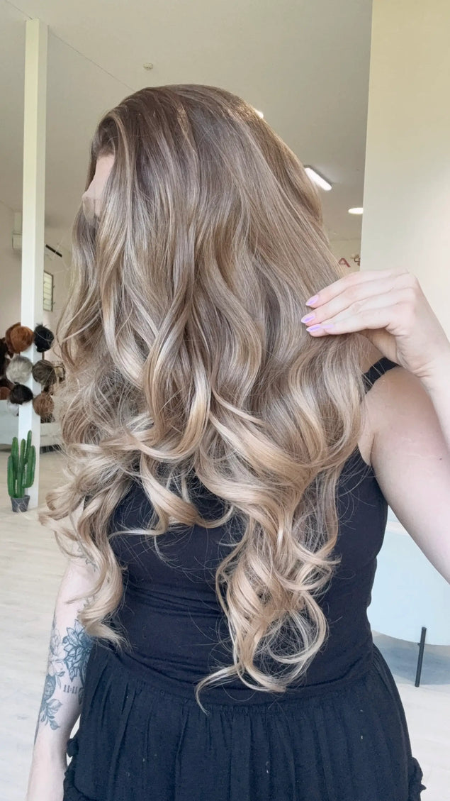 lace front glueless synthetic, darker root to soft light brown ends. heat safe wig, changeable parting.