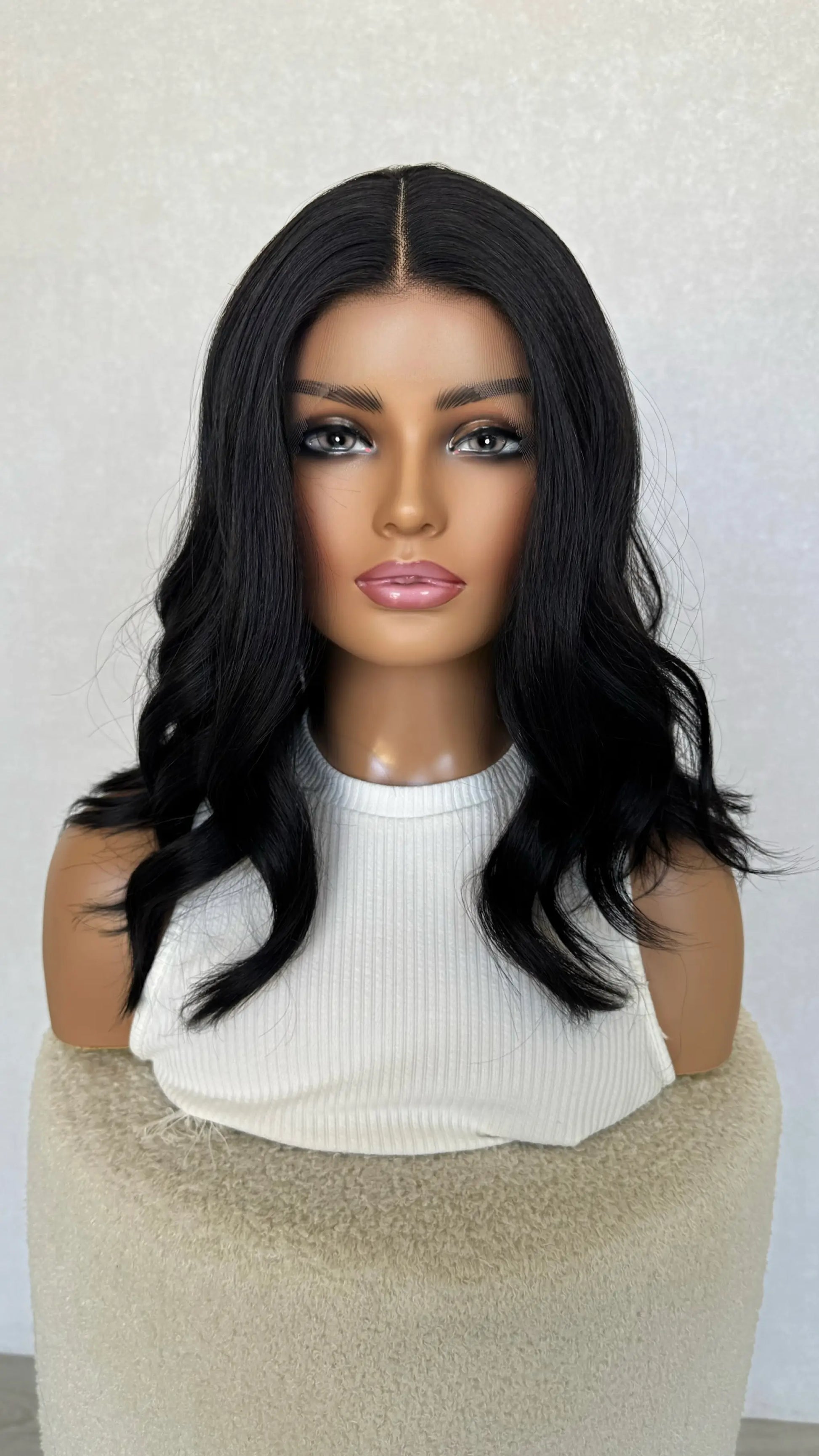 black synthetic wig, heat safe hair, middle part, 14-16 inch length.