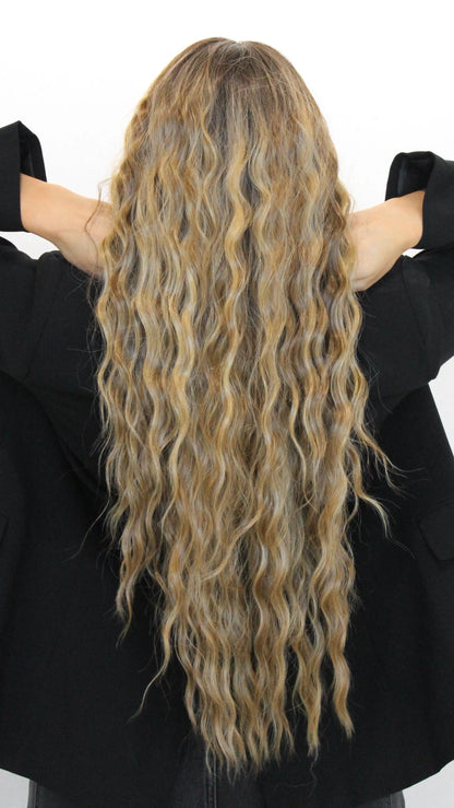 long lacefront wig from behind, wavy brunette hair with highlights.
