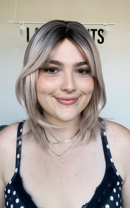 natural looking dimensional rose blonde with dark root wig.