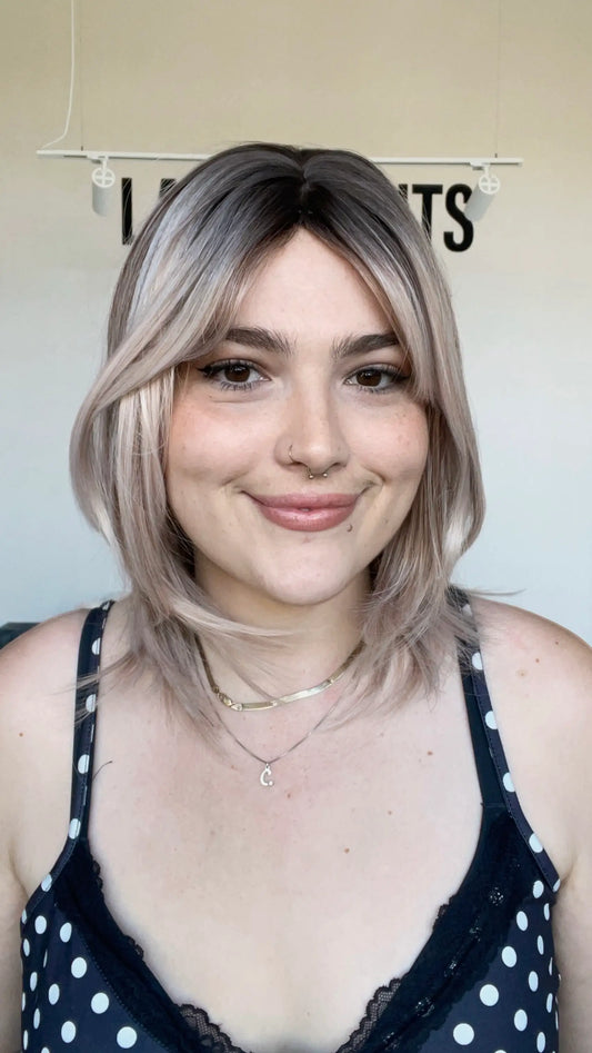 natural looking dimensional rose blonde with dark root wig.