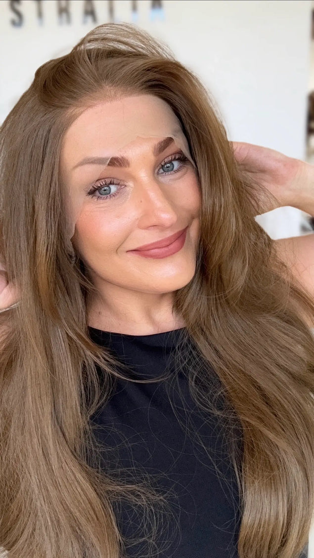 left side part soft warm brunette with layers and bouncy blowout styling. glueless lace front wig cap.