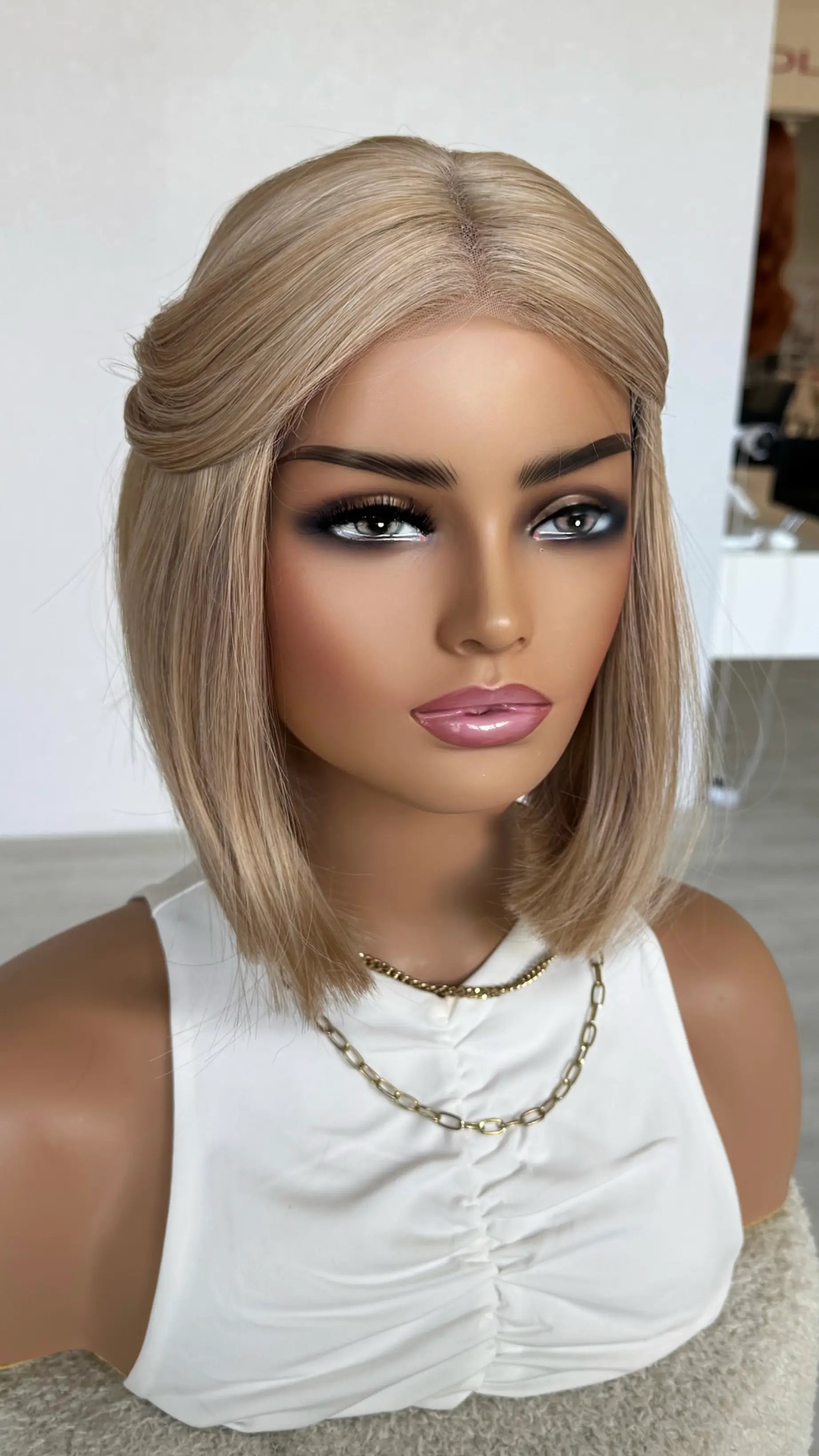 left side view dreaming synthetic, lacefront bob 12 inch, no root, peachy light blonde colour.