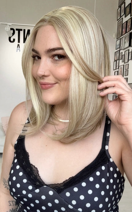 heat safe synthetic wig in buttery blonde colour and long bob length.
