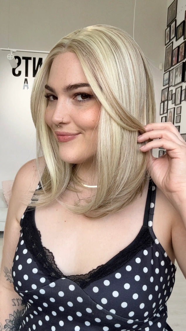 heat safe synthetic wig in buttery blonde colour and long bob length.