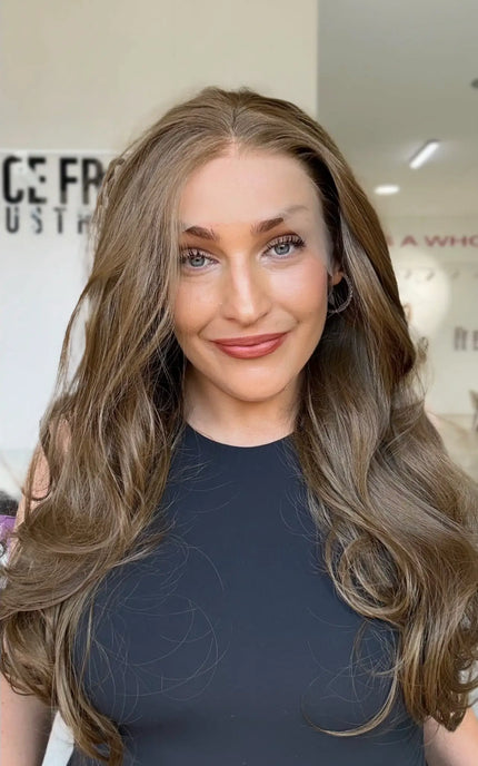 lace front wig with soft light to mid brown hair, bouncy layers throughout with a blow out styling, middle part.