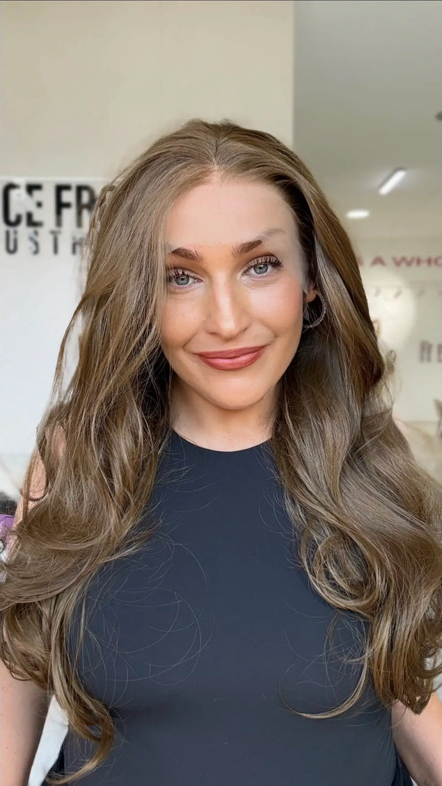 lace front wig with soft light to mid brown hair, bouncy layers throughout with a blow out styling, middle part.